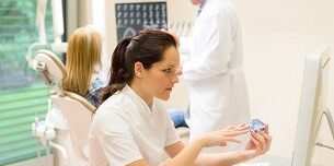 Dental surgery nurse hold print of teeth toothprints