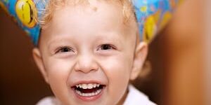 Happy laughing little boy teeth