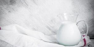 Milk jar on wooden rustic background teeth, milk, decay, san diego dentist, kid's dentist san diego