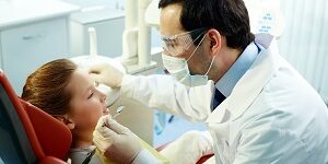 Dentist and patient Kid's toothache exam
