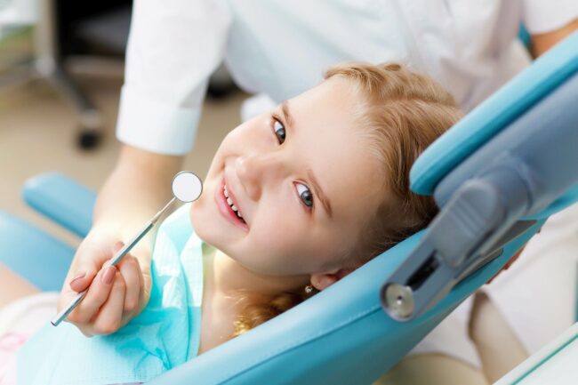 15186948 – little girl sitting in the dentists office little girl sitting