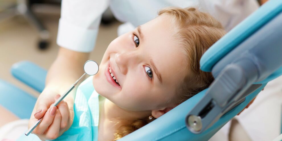 15186948 – little girl sitting in the dentists office little girl sitting