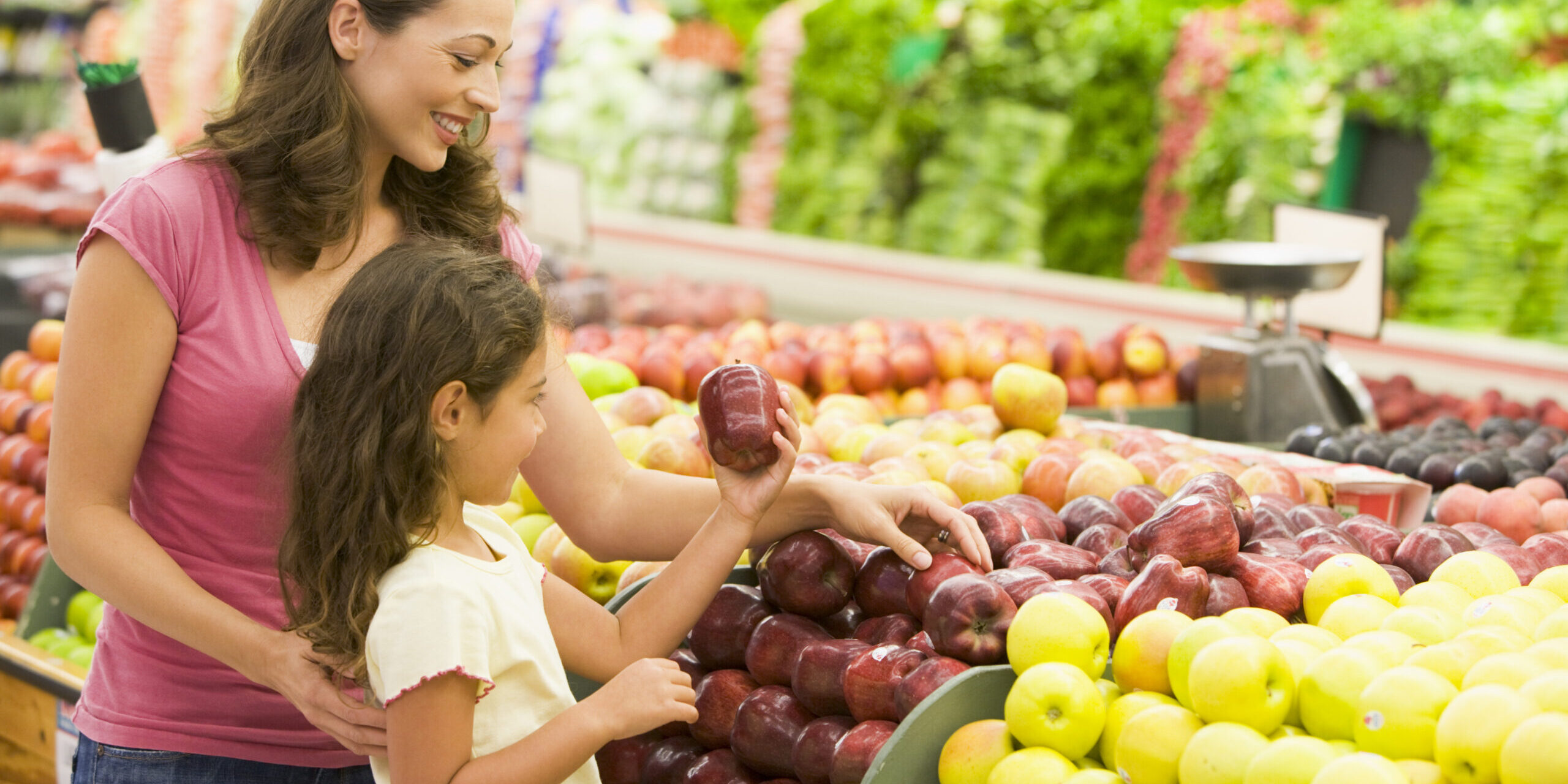 Mother and daughter shopping for fresh produce Children's Dentist San Diego